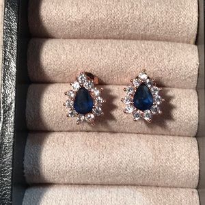 Large Blue Topaz Center Stone Surrounded by CZ’s